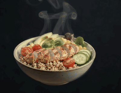 A FitNFlex protein bowl with ingredients floating around it